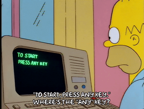 Homer Simpson trying to boot up computer
